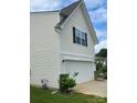Front exterior showcasing attached garage and the architectural details at 110 Silver Oak Cir, Rockwell, NC 28138
