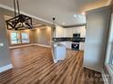 Bright kitchen with white cabinets, a mosaic backsplash, granite counters, and stainless steel appliances at 3251 Wilson Ct # 10, Lincolnton, NC 28092