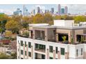 Luxury condo with city skyline views and private rooftop terrace at 130 Cherokee Rd # 404, Charlotte, NC 28207