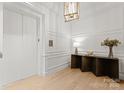 Elegant entryway features a modern console table and elevator access at 130 Cherokee Rd # 404, Charlotte, NC 28207