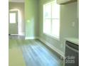 Simple dining area with wood-look flooring and neutral walls at 325 Jordan Ave, Spencer, NC 28159