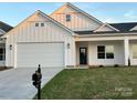 Beautiful white home with a well-manicured lawn and classic architectural details at 120-B Deer Brook Dr, Shelby, NC 28150