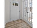 Bright entryway featuring hardwood floors and a white front door and french doors at 4210 Alexander View Dr # 38, Charlotte, NC 28226