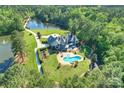 Expansive estate features a pool, pond, and lush, mature landscaping at 525 Lake Lynn Rd, Concord, NC 28025