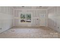 Unfinished living room with drywall, a window, and a door at 6190 Lowder Rd, Salisbury, NC 28147