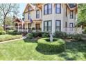 Well-maintained front yard highlighting the lush lawn and manicured shrubbery at 235 Walnut St, Statesville, NC 28677