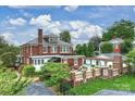 Brick house with pool and detached garage at 215 N Main St, Belmont, NC 28012