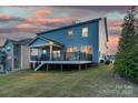 Elevated deck with a metal railing and stairs leading to the backyard at 4212 Linville Way, Fort Mill, SC 29707