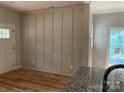 Dining space featuring modern wainscoting and new hard wood flooring at 814 W Raleigh W Ave, Statesville, NC 28677