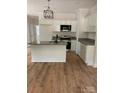 New kitchen with granite countertops, stainless steel appliances, and white cabinets at 814 W Raleigh W Ave, Statesville, NC 28677