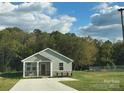 Charming single-story home with a well-manicured lawn and inviting curb appeal at 2668 Meadow St, Gastonia, NC 28056