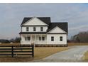Two story white house with black accents and a wooden fence at 1145 Philbeck Rd # 11, York, SC 29745