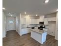 Modern kitchen with island and stainless steel appliances at 5033 Falstone Dr, Charlotte, NC 28269