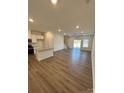 Spacious living room with hardwood floors and access to backyard at 5033 Falstone Dr, Charlotte, NC 28269