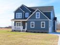 Two-story house, blue siding, white trim, and partial view of driveway at 1169 Philbeck Rd # 12, York, SC 29745