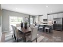 Kitchen and dining area with hardwood floors and modern furnishings at 452 Moondance Dr, Gastonia, NC 28054