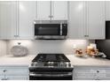 Stainless steel gas cooktop and microwave in a modern kitchen setting at 452 Moondance Dr, Gastonia, NC 28054