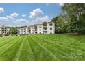 Condo building and expansive green space at 17810 Half Moon Ln # Q, Cornelius, NC 28031