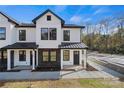 Modern townhome with white exterior and black metal roof at 204 Kimball Rd, China Grove, NC 28023