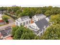 An aerial view of modern townhomes showcases their architectural design and community layout, surrounded by lush greenery at 1413 Collier Walk Aly # Csw0106, Charlotte, NC 28205