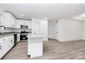 Modern kitchen with white cabinets, granite counters, and stainless steel appliances at 6100 Lowder Rd, Salisbury, NC 28147