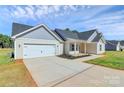Attractive single-story home featuring an attached garage and well-maintained landscaping, perfect for curb appeal at 6154 Lowder Rd, Salisbury, NC 28147