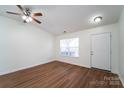 Open living room with hardwood floors and a neutral color palette at 2327 Hope Valley Ln, Charlotte, NC 28213