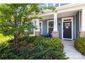Charming front porch with stone accents, well-kept garden, and inviting entrance at 3023 Spinner Ct, Denver, NC 28037