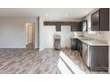 Modern kitchen featuring dark brown cabinets and stainless steel appliances at 7741 Marlette Ln, Sherrills Ford, NC 28673