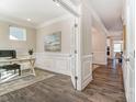 Bright office space features elegant wainscoting, hardwood floors, and plenty of natural light, ideal for remote work at 130 Summerhill Dr # 16, Mooresville, NC 28115