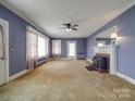 Living room with fireplace and built-in shelving at 5237 Nc Highway 90 E Hwy, Hiddenite, NC 28636
