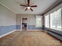 Spacious living room featuring carpet and large windows at 5237 Nc Highway 90 E Hwy, Hiddenite, NC 28636