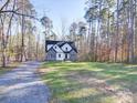 Craftsman style home with stone and white accents, located on a wooded lot at 248 Pioneer Dr # 990, Mount Gilead, NC 27306
