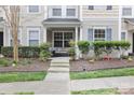 Inviting front porch with outdoor seating, perfect for relaxing and enjoying the neighborhood at 17615 Trolley Crossing Way, Cornelius, NC 28031