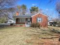 Charming brick home with a cozy front porch and well-maintained lawn at 553 Georgia Ave, Statesville, NC 28677