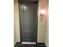 Private apartment door with modern gray finish at 701 Royal Ct # 309, Charlotte, NC 28202