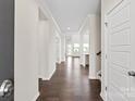Bright hallway with hardwood floors leading to various rooms at 4679 Hopsack Dr # Cal0108, Indian Trail, NC 28079