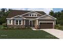 Modern single-story home with brown siding, stone accents and a two-car garage at 2533 Crimson N Way, Monroe, NC 28112