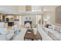 Open-concept living room with hardwood floors and a view of the kitchen at 4023 Randolph Rd, Charlotte, NC 28211