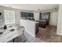 Bright kitchen and dining area with stainless steel appliances and convenient access to outdoor spaces at 805 W Main St, Marshville, NC 28103