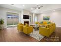 Bright living room featuring a fireplace, hardwood floors, and modern decor with lots of natural light at 833 B Wynnshire Dr # 55, Hickory, NC 28601