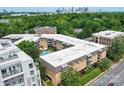 Aerial view of apartment building with pool and city skyline at 1323 Queens Rd # 212, Charlotte, NC 28207