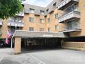 Brick apartment building with covered parking at 1323 Queens Rd # 212, Charlotte, NC 28207