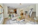 Open-concept living area seamlessly flows into the kitchen and dining room with lots of natural light at 2907 Meherrin Ct, Waxhaw, NC 28173