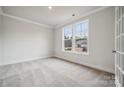 Bright office space featuring carpeted floors and large windows at 108 Brooke Forest Ct, Mooresville, NC 28115