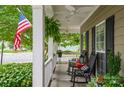 Relaxing front porch with rocking chairs and hanging plants at 3203 Kelsey Plz, Kannapolis, NC 28081
