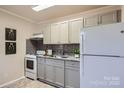 Efficient kitchen featuring modern cabinetry, stainless appliances, and granite countertops at 3210 Marlborough Rd, Charlotte, NC 28208