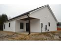 White house with black roof and covered porch at 1239 Beltline Rd # 10, Chester, SC 29706