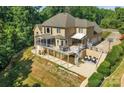 Home with a large deck, spiral staircase, and screened porch at 122 Long Cove Ln, Mooresville, NC 28117