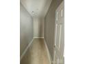 Neutral-toned hallway with new carpet and doors at 1011 Indiana St, Kannapolis, NC 28083
